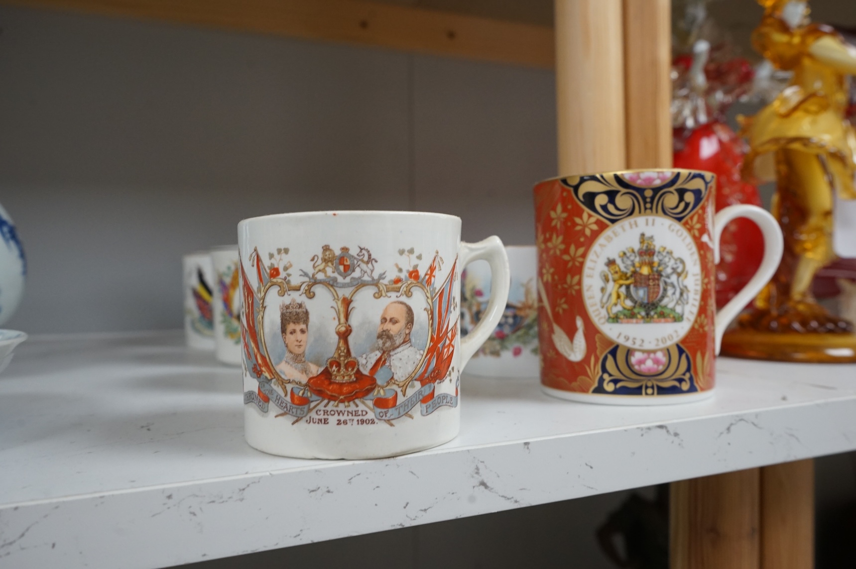 A lithophane commemorative mug and ten others to include George VI and Elizabeth coronation 1937, largest 9.5cm high